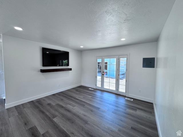 5135 W 4170 S, West Valley City, UT 84120 - unfurnished living room featuring electric panel, dark wood-style flooring, baseboards, a textured ceiling, and recessed lighting