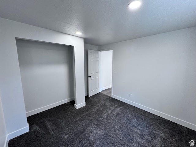 5135 W 4170 S, West Valley City, UT 84120 - unfurnished bedroom with dark carpet, baseboards, recessed lighting, a textured ceiling, and a closet