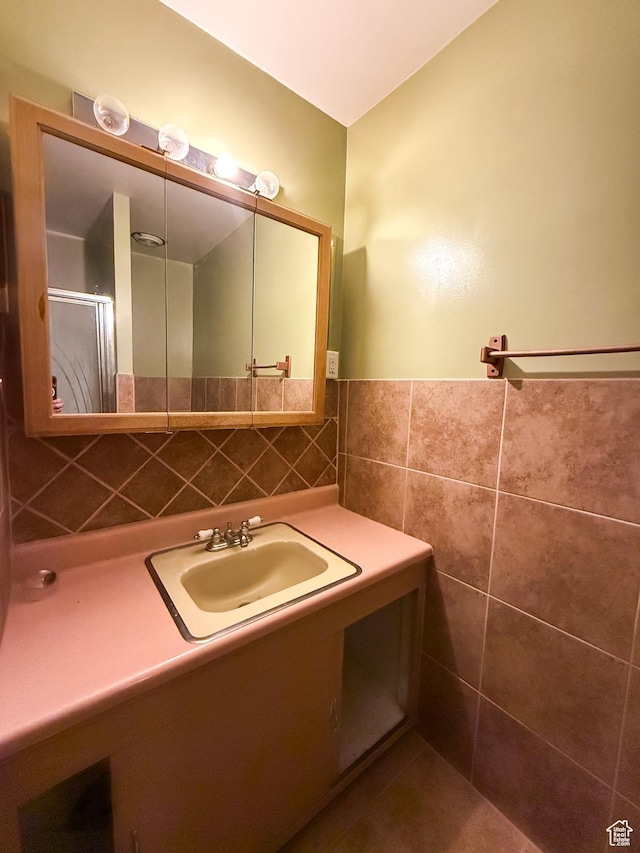 775 N 500 E, Price, UT 84501 - bathroom featuring tile walls, vanity, and a wainscoted wall