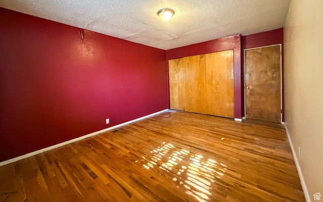 775 N 500 E, Price, UT 84501 - unfurnished bedroom featuring wood finished floors, a textured ceiling, and baseboards