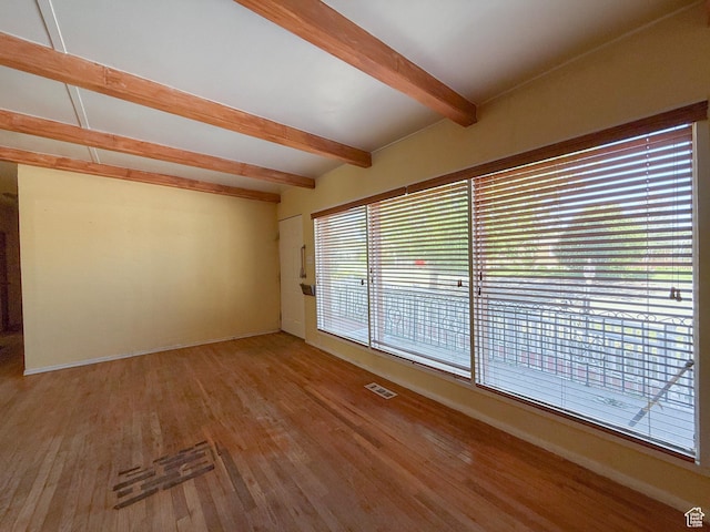 775 N 500 E, Price, UT 84501 - empty room with beamed ceiling, wood finished floors, and baseboards