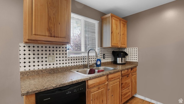 6828 W Copperhill Dr, West Valley City, UT 84128 - kitchen featuring black dishwasher, a sink, backsplash, light wood-style floors, and dark countertops