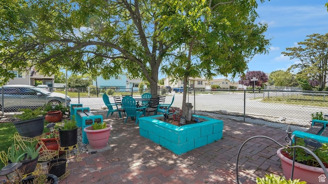 6828 W Copperhill Dr, West Valley City, UT 84128 - view of property's community featuring a patio area