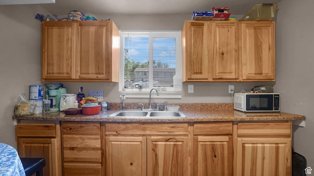 6828 W Copperhill Dr, West Valley City, UT 84128 - kitchen featuring a sink, light brown cabinetry, and light countertops