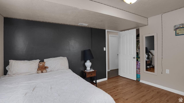 6828 W Copperhill Dr, West Valley City, UT 84128 - bedroom with wood finished floors and baseboards