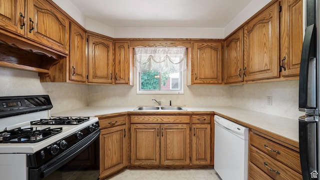 374 N 500 E, Spanish Fork, UT 84660 - kitchen with range with gas cooktop, dishwasher, brown cabinets, and a sink