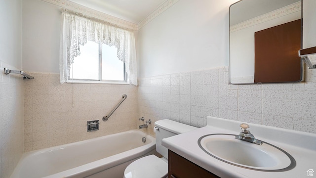 374 N 500 E, Spanish Fork, UT 84660 - bathroom with toilet, tile walls, vanity, a wainscoted wall, and shower / washtub combination