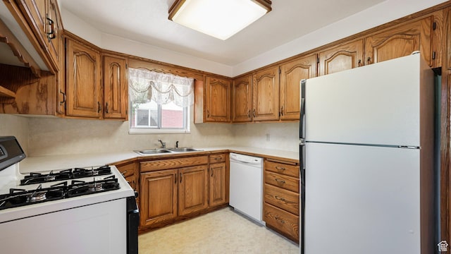 374 N 500 E, Spanish Fork, UT 84660 - kitchen featuring white appliances, brown cabinets, a sink, light countertops, and light flooring