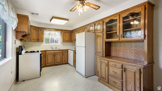 374 N 500 E, Spanish Fork, UT 84660 - kitchen with white appliances, brown cabinets, a ceiling fan, light floors, and a sink