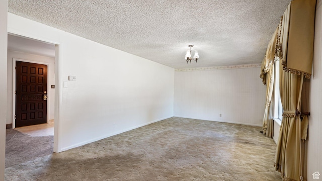 374 N 500 E, Spanish Fork, UT 84660 - empty room with a chandelier, carpet flooring, baseboards, and a textured ceiling