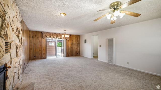 374 N 500 E, Spanish Fork, UT 84660 - unfurnished living room with a heating unit, a textured ceiling, wood walls, ceiling fan, and carpet flooring
