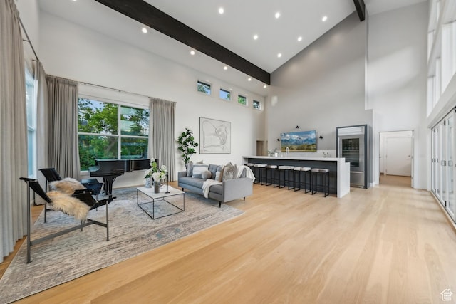 2067 E Pheasant Cir, Holladay, UT 84121 - living room featuring high vaulted ceiling, light wood-type flooring, beam ceiling, wine cooler, and recessed lighting