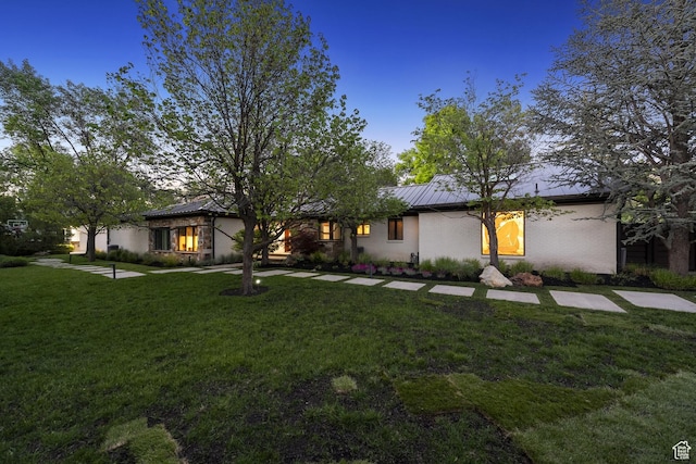 2067 E Pheasant Cir, Holladay, UT 84121 - mid-century inspired home with a front lawn, metal roof, and a standing seam roof