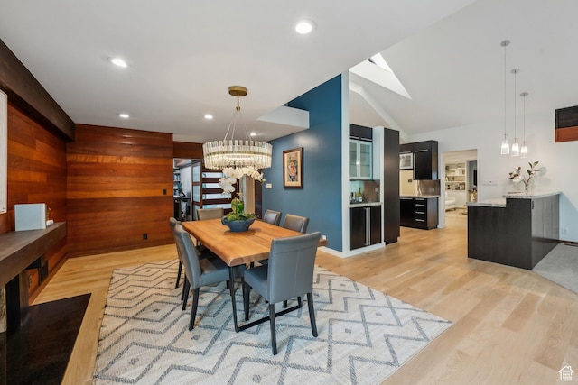 2067 E Pheasant Cir, Holladay, UT 84121 - dining area with a chandelier, light wood-style flooring, recessed lighting, a skylight, and lofted ceiling