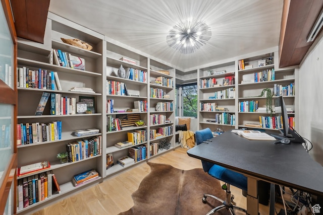 2067 E Pheasant Cir, Holladay, UT 84121 - office with wood finished floors, bookshelves, and a chandelier