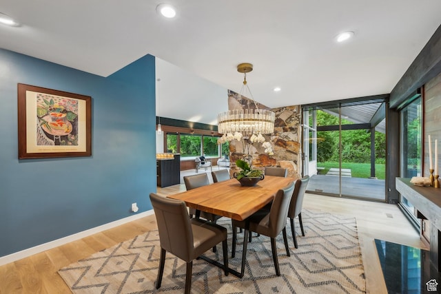 2067 E Pheasant Cir, Holladay, UT 84121 - dining area with wood finished floors, a chandelier, healthy amount of natural light, baseboards, and recessed lighting
