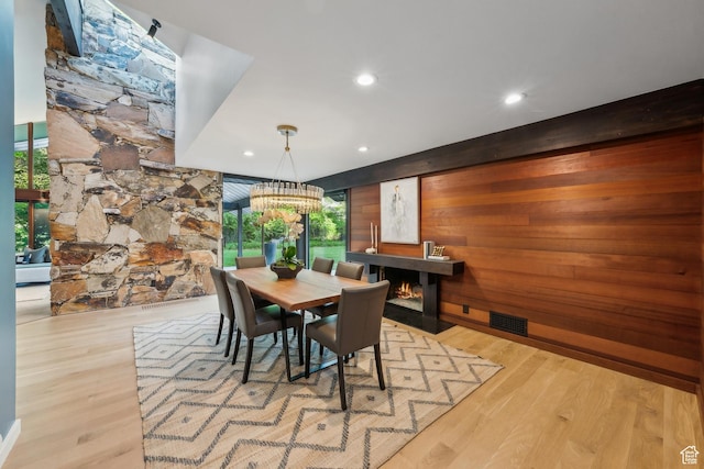 2067 E Pheasant Cir, Holladay, UT 84121 - dining room featuring a fireplace with flush hearth, wood finished floors, recessed lighting, and a chandelier