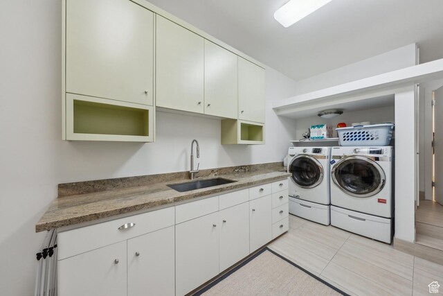 2067 E Pheasant Cir, Holladay, UT 84121 - laundry area featuring washing machine and clothes dryer and light tile patterned floors