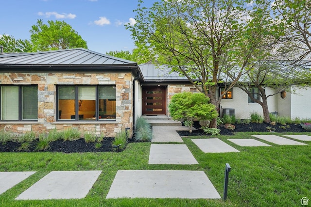2067 E Pheasant Cir, Holladay, UT 84121 - contemporary home with a standing seam roof, stone siding, a front yard, and metal roof