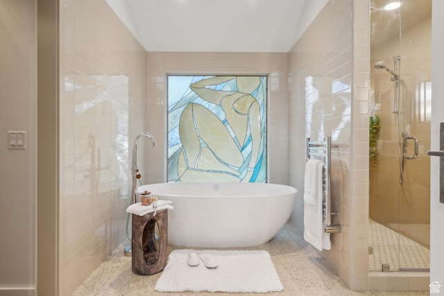 2067 E Pheasant Cir, Holladay, UT 84121 - full bathroom featuring speckled floor, a stall shower, radiator, a soaking tub, and lofted ceiling