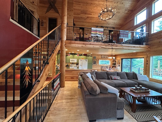 9281 N Uinta Dr Unit 348, Oakley, UT 84055 - living room with a chandelier, high vaulted ceiling, healthy amount of natural light, hardwood / wood-style floors, and wood ceiling