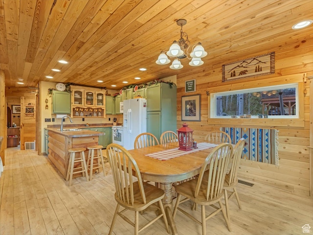 9281 N Uinta Dr, Oakley, UT 84055 - dining space with wooden ceiling, a chandelier, wooden walls, light wood-type flooring, and recessed lighting