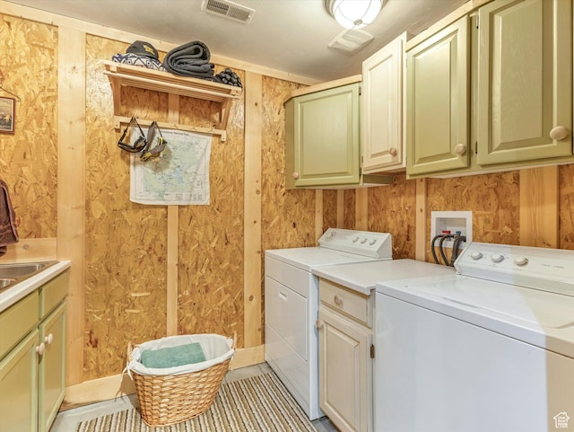 9281 N Uinta Dr, Oakley, UT 84055 - laundry room with cabinet space, washing machine and dryer, and light tile patterned flooring