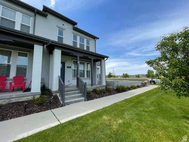 5957 W Lake Ave, South Jordan, UT 84009 - view of front of home featuring a porch and stucco siding