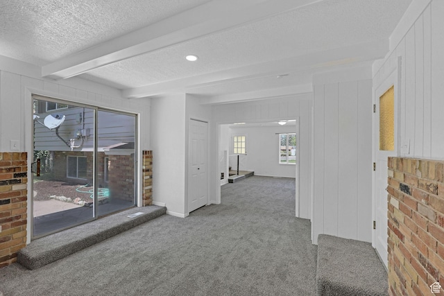 181 E 5150 S, Washington Terrace, UT 84405 - carpeted spare room featuring a textured ceiling and beamed ceiling