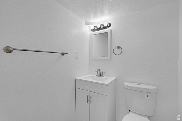 181 E 5150 S, Washington Terrace, UT 84405 - bathroom with vanity, toilet, and a textured ceiling