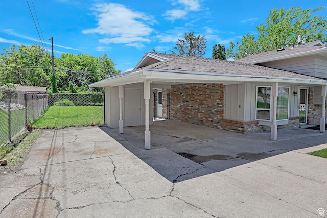 181 E 5150 S, Washington Terrace, UT 84405 - view of patio with an attached carport and driveway