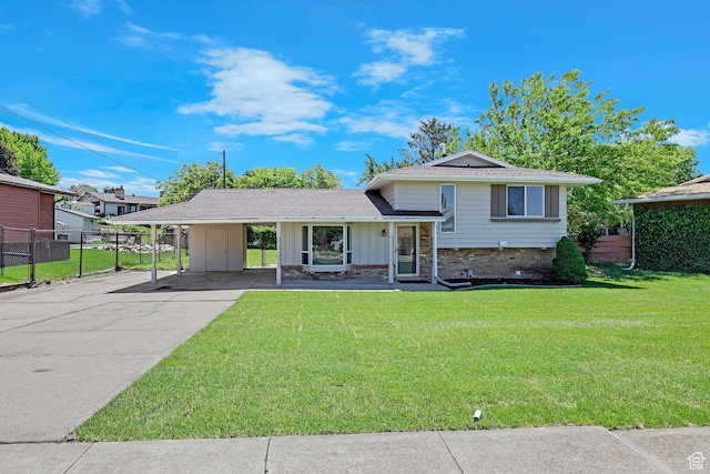 181 E 5150 S, Washington Terrace, UT 84405 - tri-level home with board and batten siding, a carport, driveway, and roof with shingles