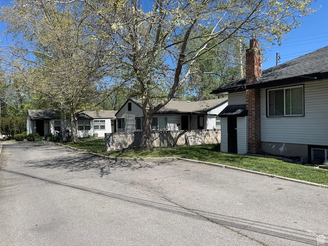 751 E Scott Ave, Millcreek, UT 84106 - view of front of house with a chimney