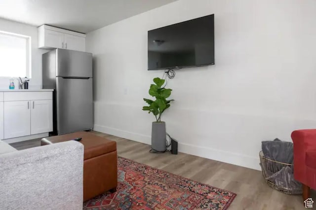 751 E Scott Ave, Millcreek, UT 84106 - living room featuring baseboards and wood finished floors