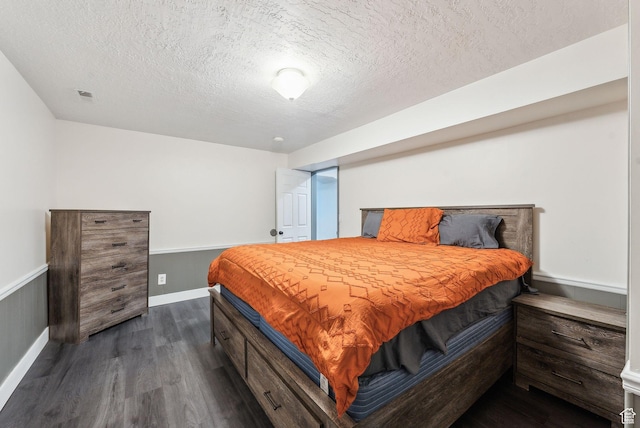 981 N Tremont St, Tremonton, UT 84337 - bedroom featuring dark wood-style floors, a textured ceiling, and baseboards