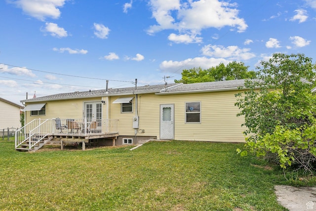 981 N Tremont St, Tremonton, UT 84337 - rear view of property with a wooden deck and a lawn