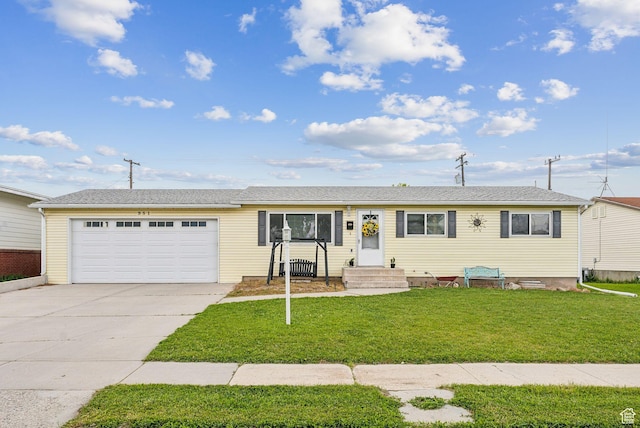 981 N Tremont St, Tremonton, UT 84337 - ranch-style house with a garage, driveway, and a front yard