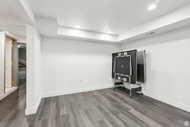 981 N Tremont St, Tremonton, UT 84337 - unfurnished living room featuring wood finished floors, baseboards, recessed lighting, and a tray ceiling