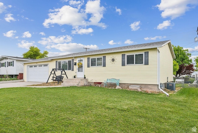 981 N Tremont St, Tremonton, UT 84337 - ranch-style house featuring a garage, concrete driveway, and cooling unit