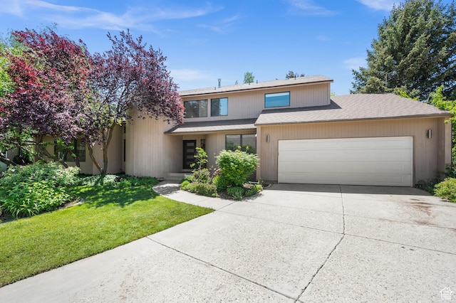 8848 S Willow Hills Ct, Sandy, UT 84093 - view of front of property featuring an attached garage, driveway, roof with shingles, and a front lawn