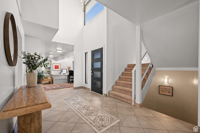 8848 S Willow Hills Ct, Sandy, UT 84093 - tiled foyer featuring a towering ceiling, stairway, and baseboards