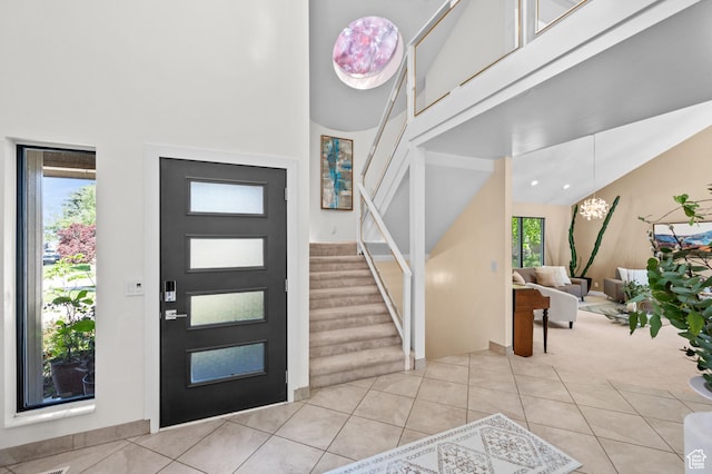 8848 S Willow Hills Ct, Sandy, UT 84093 - foyer with a towering ceiling, stairway, and light tile patterned floors