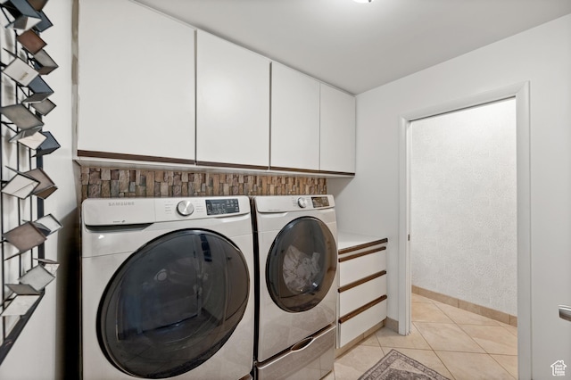 8848 S Willow Hills Ct, Sandy, UT 84093 - laundry area with cabinet space, independent washer and dryer, light tile patterned flooring, and baseboards