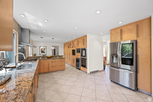 8848 S Willow Hills Ct, Sandy, UT 84093 - kitchen featuring stainless steel appliances, a peninsula, a sink, light stone countertops, and beverage cooler