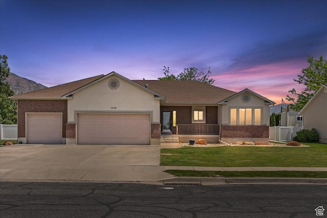 3524 N 3000 W, Farr West, UT 84404 - ranch-style home featuring a garage, driveway, stucco siding, and covered porch