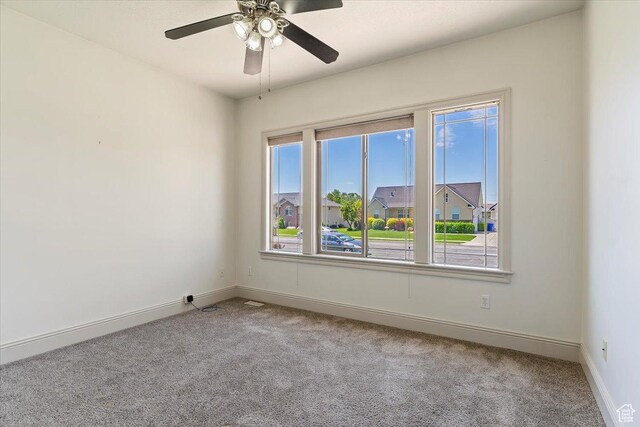 3524 N 3000 W, Farr West, UT 84404 - empty room featuring carpet, baseboards, and a ceiling fan