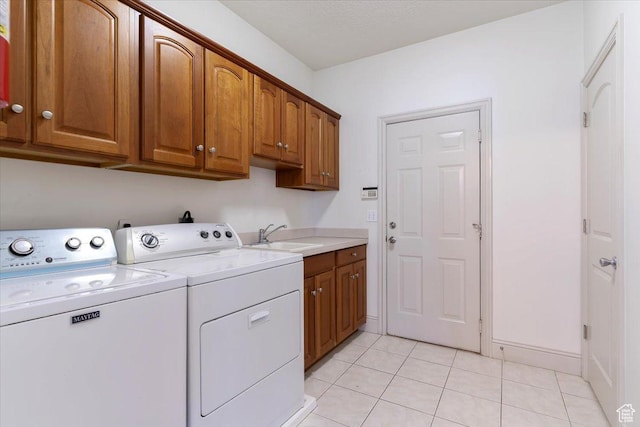 3524 N 3000 W, Farr West, UT 84404 - laundry room with separate washer and dryer, cabinet space, light tile patterned floors, and baseboards