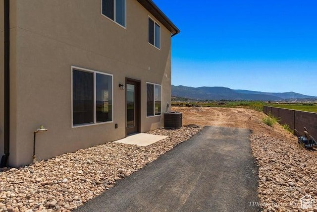 535 W 2530 N Unit 6-10, Cedar City, UT 84721 - view of home's exterior featuring a mountain view, stucco siding, cooling unit, and a patio