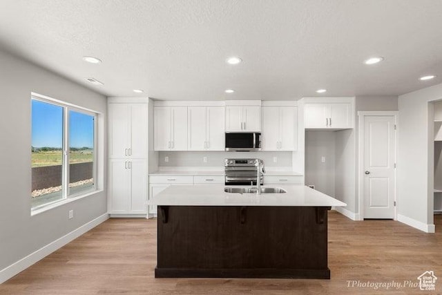 535 W 2530 N Unit 6-10, Cedar City, UT 84721 - kitchen with stainless steel appliances, a sink, baseboards, light countertops, and recessed lighting