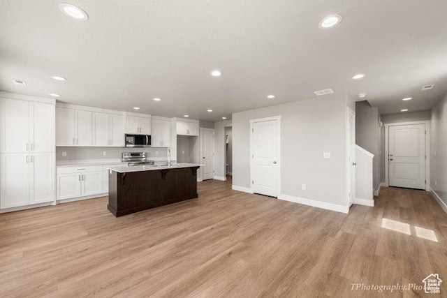535 W 2530 N Unit 6-10, Cedar City, UT 84721 - kitchen featuring appliances with stainless steel finishes, white cabinets, recessed lighting, light countertops, and light wood-type flooring